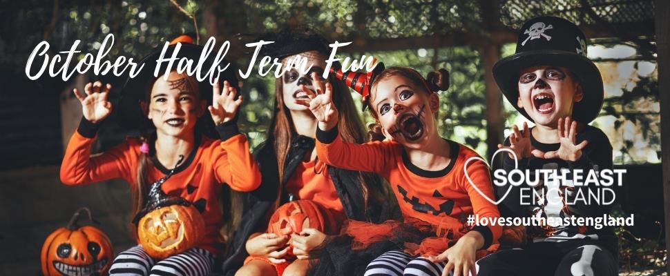 Picture of children celebrating Halloween, all dressed up in spooky costumes.
