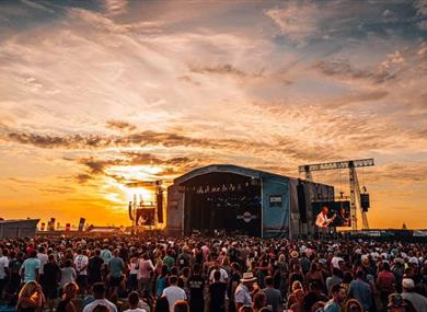 Sunset at the Victorious Festival main stage as Ocean Colour Scene perform