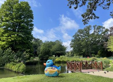 giant blue painted rubber duck by pond at alexandra park hastings