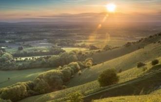 View from Ditchling Beacon Near Brighton and Hove in East Sussex at sunset.