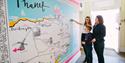 Visitors exploring the map of Thanet at the Visitor Information Centre, image credit Thanet District Council