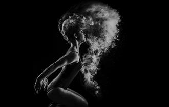 Contemporary dancer with smoky background