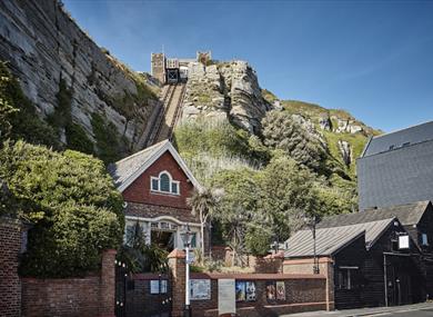 photograph of the east hill from the lower station. Shows brick building at the bottom of funicular railway cut into cliff.