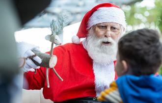 Santa Claus with a child at Port Solent’s Festival of Christmas