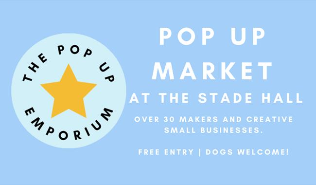 Blue poster with circular logo for the pop up emporium and a yellow star.
