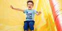 Boy sliding down the bouncy slide, Bouncy Barn, Tapnell Farm Park, children's event, what's on