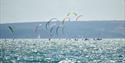 A group of kitesurfers out on the Solent. Photograph by Vernon Nash.