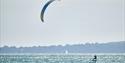 Foiling kitesurfer off the coast of Portsmouth - photograph by Vernon Nash