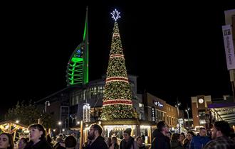 Christmas tree at Gunwharf Quays with the Spinnaker Tower in the background