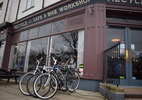 exterior of a store, with three bikes lined up outside
