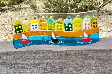 An image of a seaside scene, created in a fused glass workshop