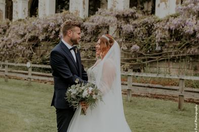 Two newlyweds pose for wedding photos