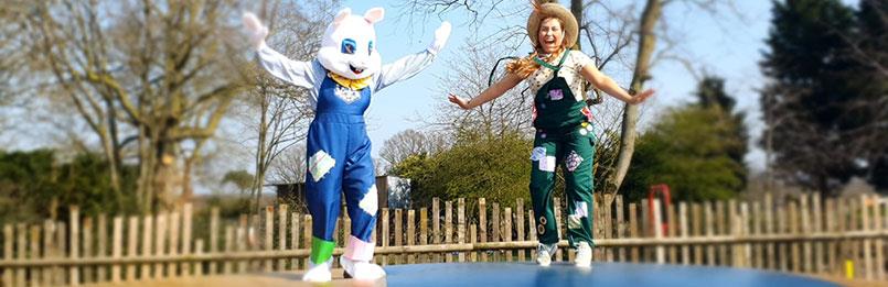 Easter Bunny and Farmer characters on outdoor jumping pillow at Lower Drayton Farm, Staffordshire