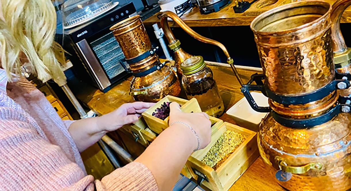 Preparing the perfect blend in a gin-making workshop at Castletown Distillery, Staffordshire