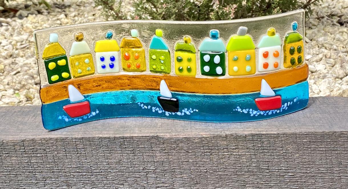 An image of a seaside scene, created in a fused glass workshop