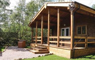 Stay in one of the timber lodges at Quarry Walk Park