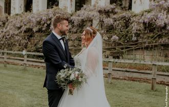 Two newlyweds pose for wedding photos