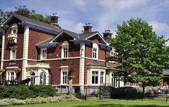 Image shows the Brampton Museum on a sunny day