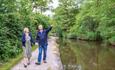 A couple walking along the Caldon Canal (near Cheddleton Flint Mill)