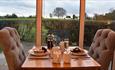 Enjoy peaceful countryside views from the comfort of Tawnies Nest lodge at Mayfield Snuggery, Staffordshire.