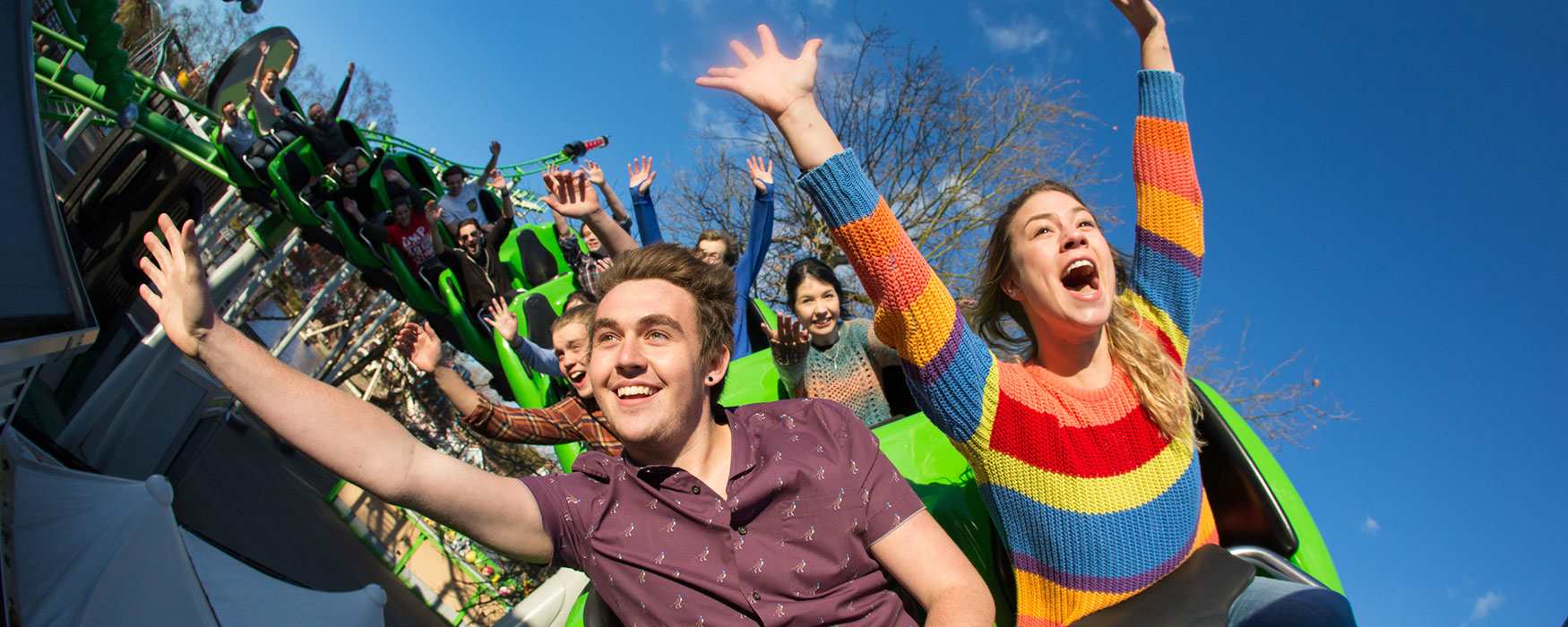 Group of people on a thrilling rollercoaster ride at one of the world-class attractions and theme parks in Staffordshire. Click to see more attractions.