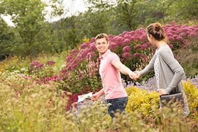 Couple exploring the floral labrinth at Trentham Gardens