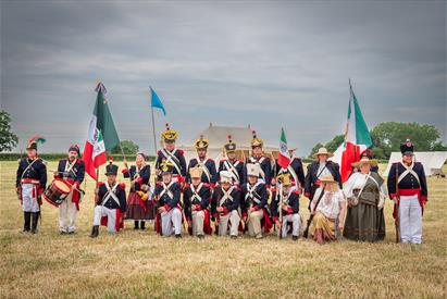 A group of soldiers re-enact a historic battle for a photography workshop