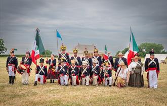 A group of soldiers re-enact a historic battle for a photography workshop