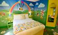 Stay in a colourful Bugbies room with separate areas for parents and children.