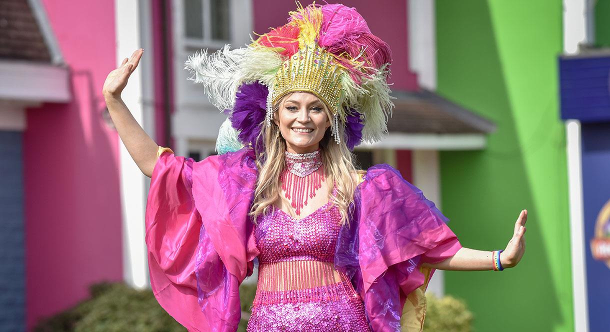 Colourfully dressed dancer at Alton Towers Mardi Gras