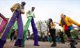 Stilt walkers entertain the guest at Alton Towers Mardi Gras event