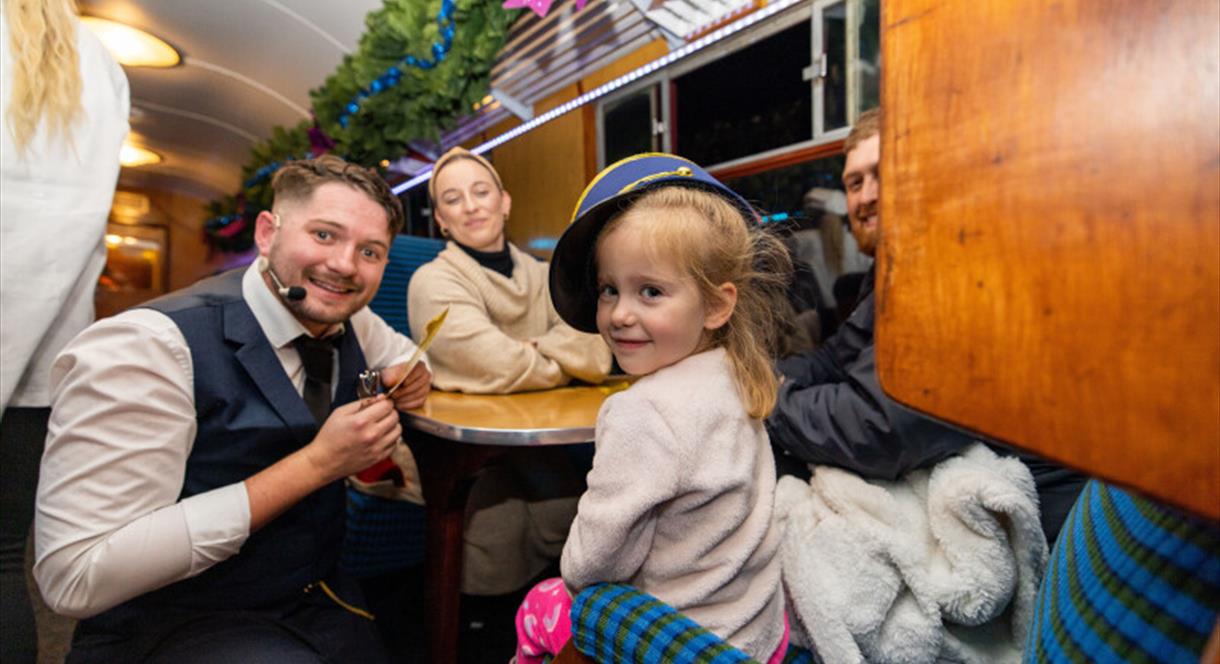 Image shows a family enjoying a festive day out on The Polar Express