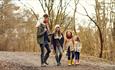 Family enjoy a walk in the deep dark woods on the Gruffalo Spotter Trail at Cannock Chase, Staffordshire