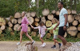 Image shows a family enjoying a summer walk