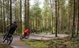 Image shows two mountain-bikers on Perry's Trail at Cannock Chase Forest