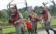 Image shows horn dancers on their traditional procession through Abbots Bromley
