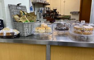 A selection of cakes on display on the counter at the Hideaway at Biddulph Grange
