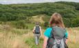 Two walkers head down Battlestead Hill on the National Forest Way in Staffordshire