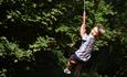 Image shows a boy on a zipwire