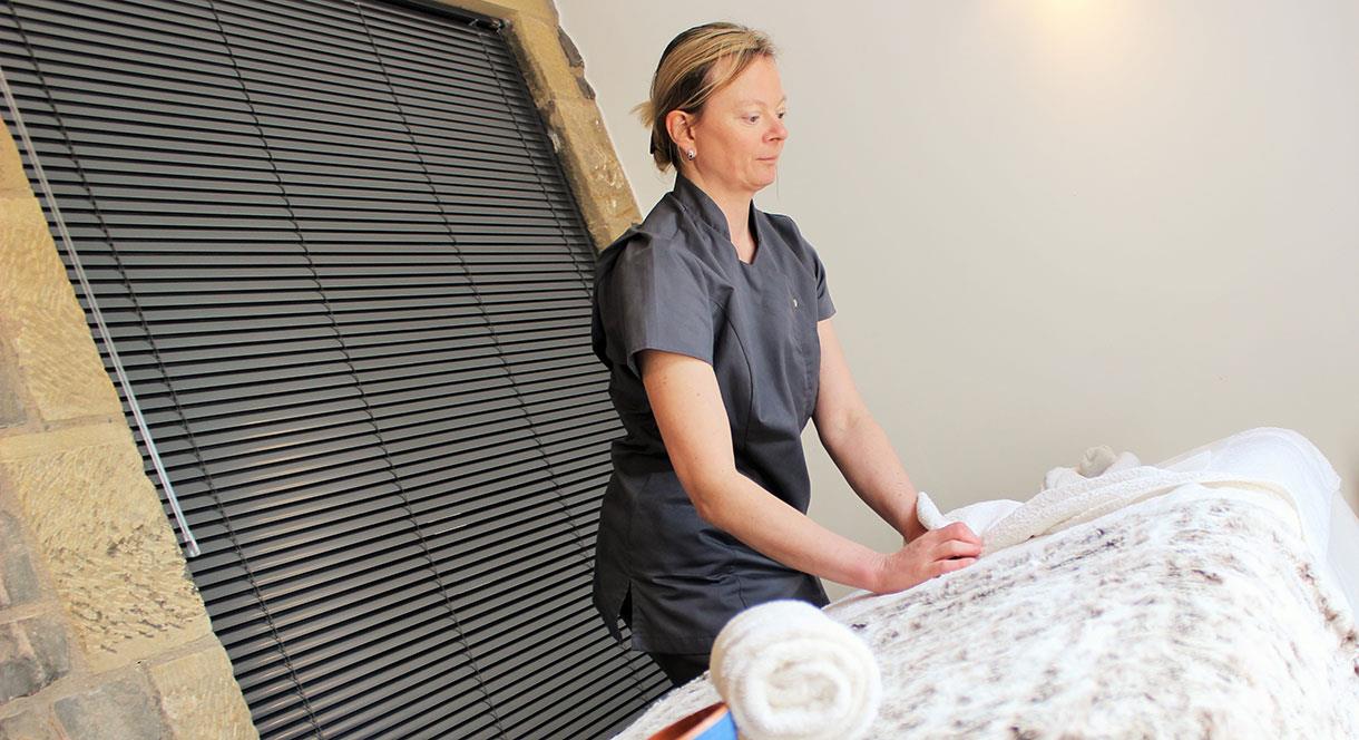 Getting the treatment couch ready at Peak Relaxation, Staffordshire