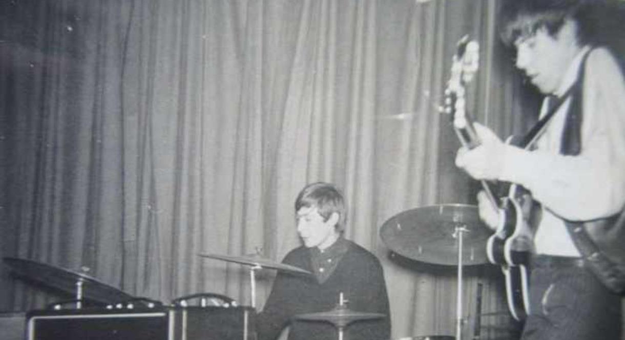 black and white photo of a band playing in the 1960s