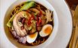 Image shows a dish of ramen