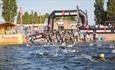 The race starts early in the morning with an open water swim across Chasewater.