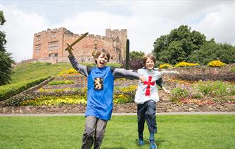 Tamworth Castle Pleasure Grounds, Tamworth, Staffordshire. Boys role playing knights in the grounds.