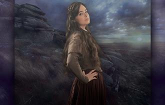 Image shows the star of Wuthering Heights, standing in front of a bleak landscape