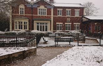 Photo shows the exterior of the Brampton Museum on a Snowy day