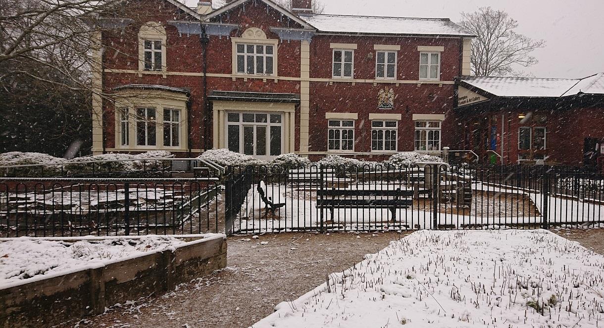 Photo shows the exterior of the Brampton museum on a snowy day