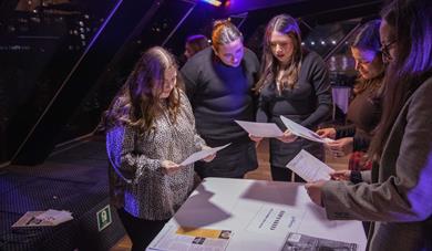 People looking at information about a murder.