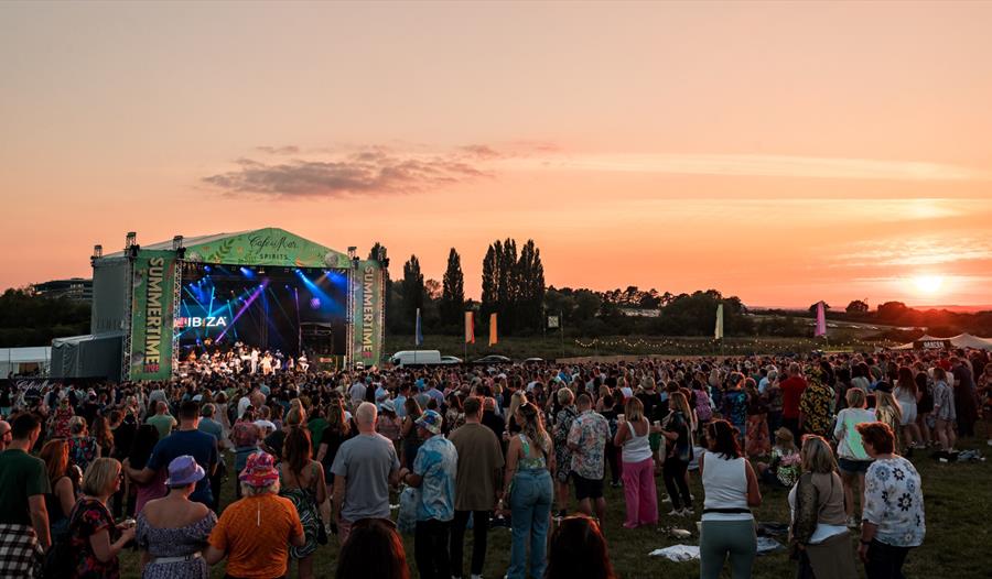 A sunset and stage at Cheltenham Racecourse