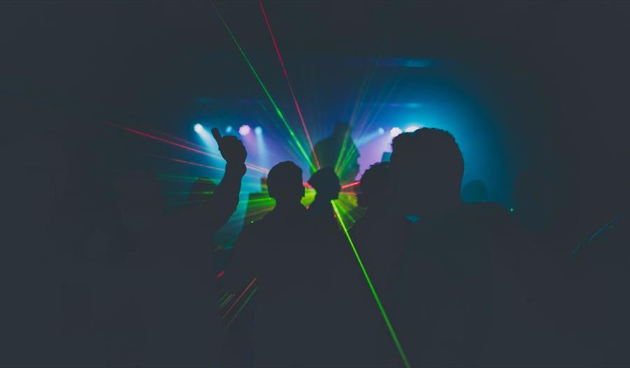 Red and green lights in busy crowd
